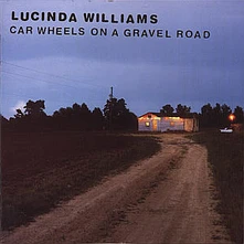 CD CAR WHEELS ON A GRAVEL ROA
