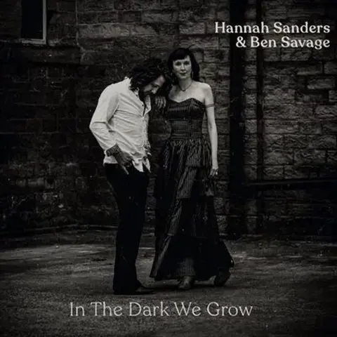 IN THE DARK WE GROW