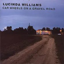 CD CAR WHEELS ON A GRAVEL ROA